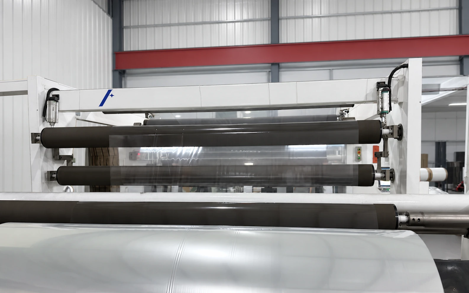 Meilin gantry-style slitting machine handling a clear film web